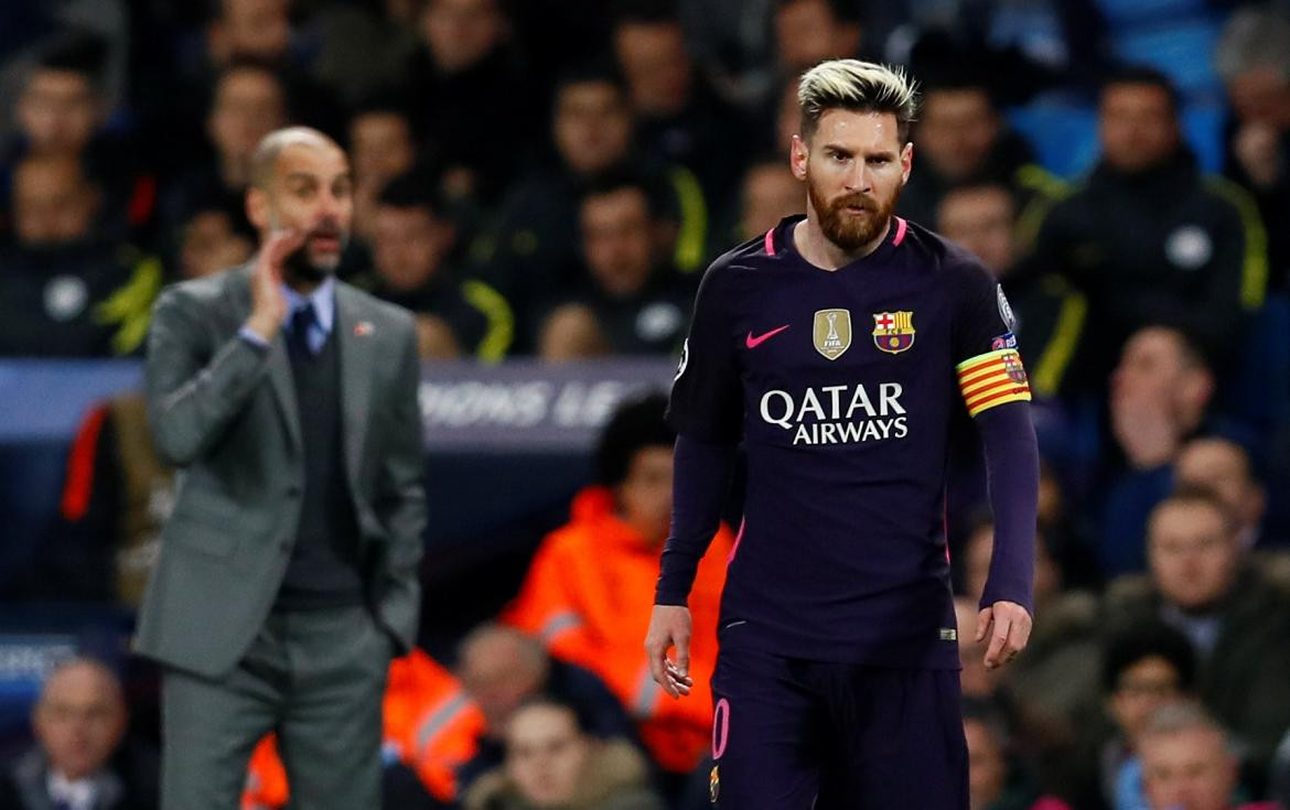 Pep Guardiola y Lionel Messi, REUTERS