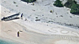SOS en la arena