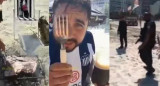 Hincha de Talleres haciendo asado en la playa, foto NA